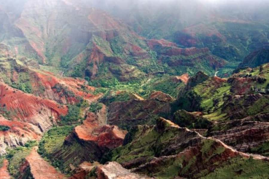 Kauai: Waimea Canyon and Waterfall Adventure Day Tour - Waimea Canyon State Park: rainbow walls and that long, deep scale